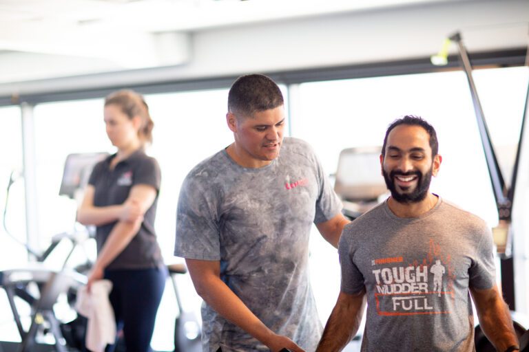 "Personal trainer guiding a client through a customized workout at Complx Strength and Conditioning Program in South Melbourne."